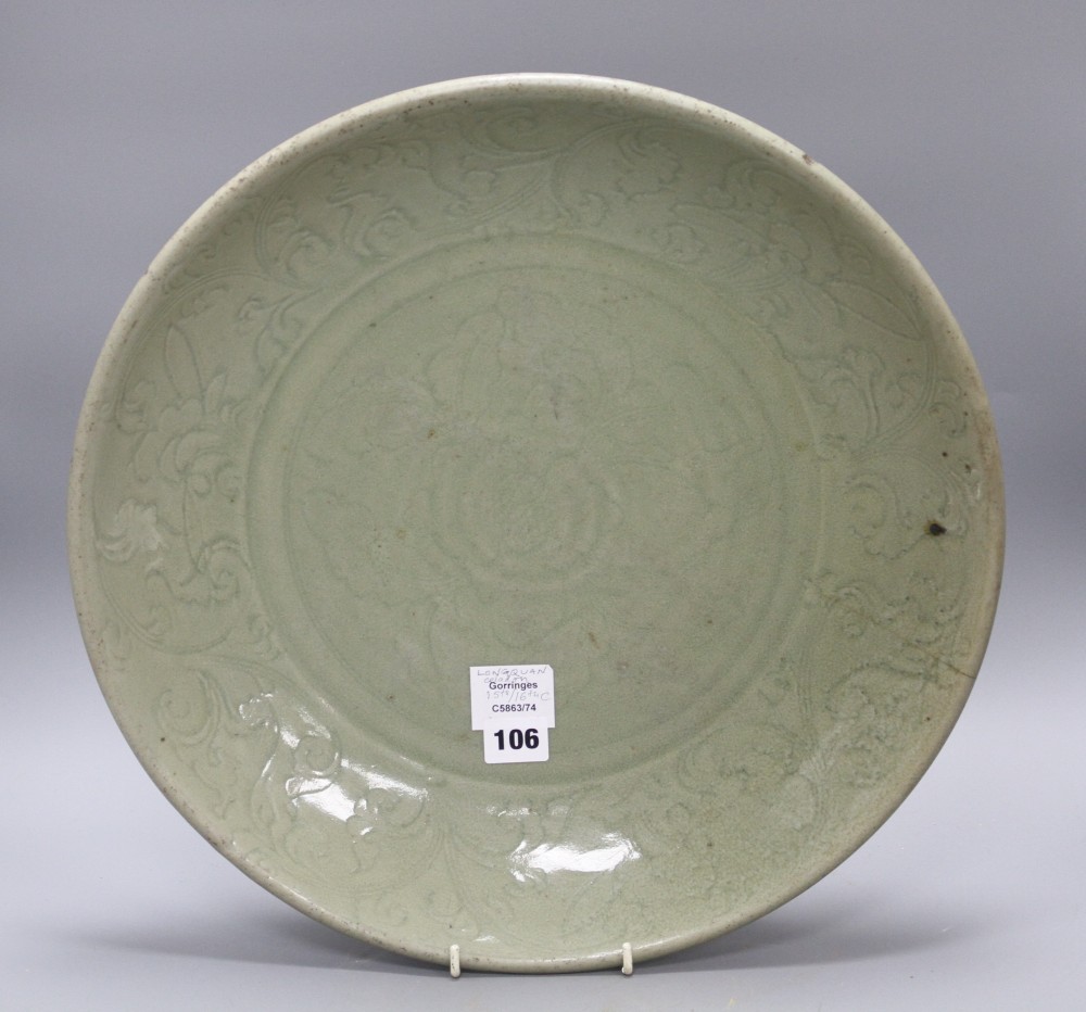 A 15th / 16th century Longquan celadon dish, incised with flowers, diameter 43cm, height 8.5cm